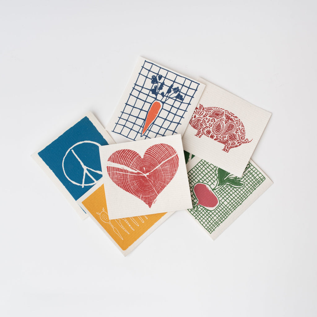 An array of six Vermont made Swedish cloth dish towels on a white background 
