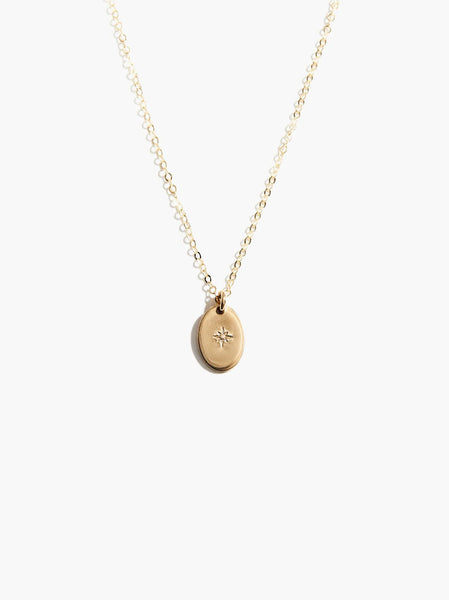 Able jewelry brand dainty oval round gold pendant necklace on a white background