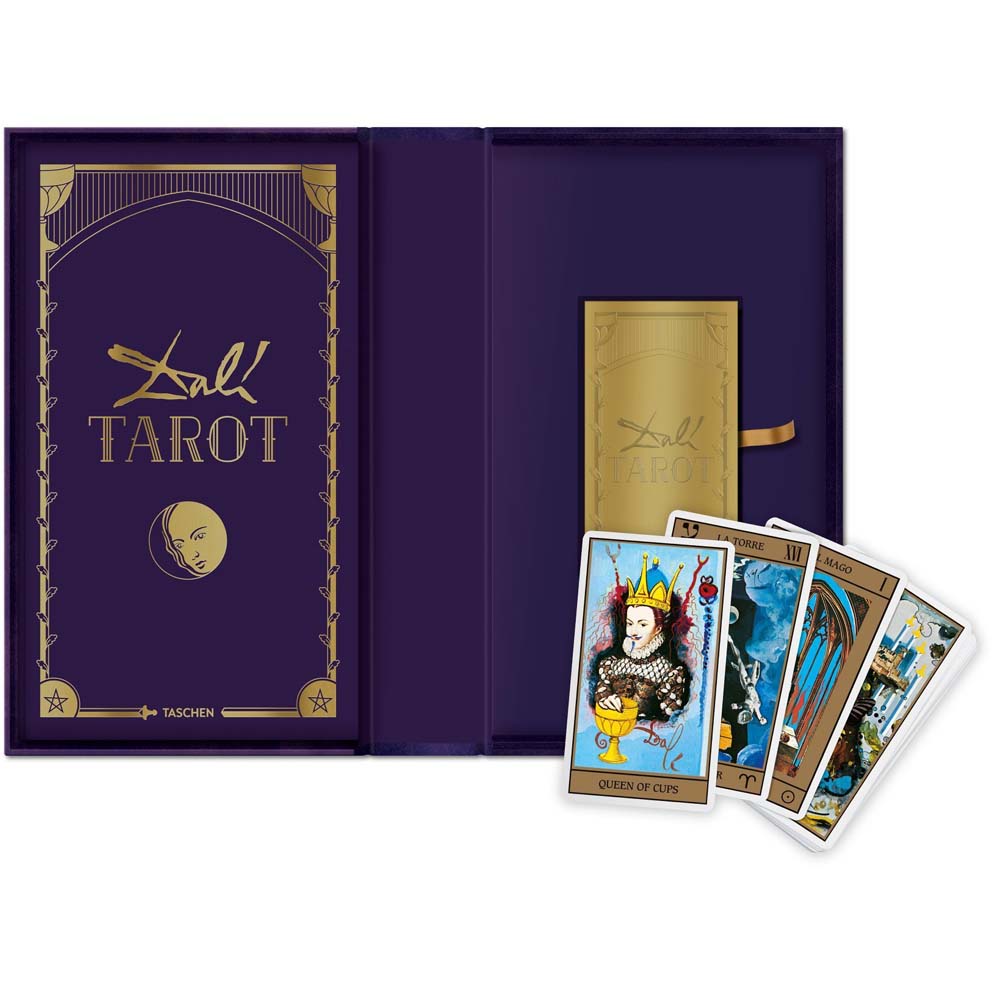 Taschen Dali Tarot inside of box with 4 cards spread out on white background