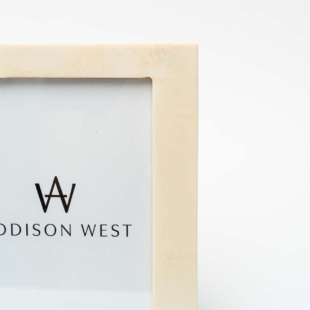 Close up of white Resin Photo Frame on a white background