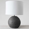 Black terra-cotta base table lamp with white canvas shade on a white background