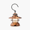 Barebones brand mini Edison lantern with vintage style and caged bulb in copper on a white background