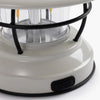 Close up of USB port on White mini Edison lantern by Barebones brand with vintage style and caged bulb on a white background