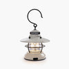 White mini Edison lantern by Barebones brand with vintage style and caged bulb on a white background