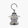 White mini Edison lantern by Barebones brand with vintage style and caged bulb on a white background