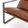 Close up of Tobacco brown leather 'Emmett' sling chair by Four hands furniture with iron frame
