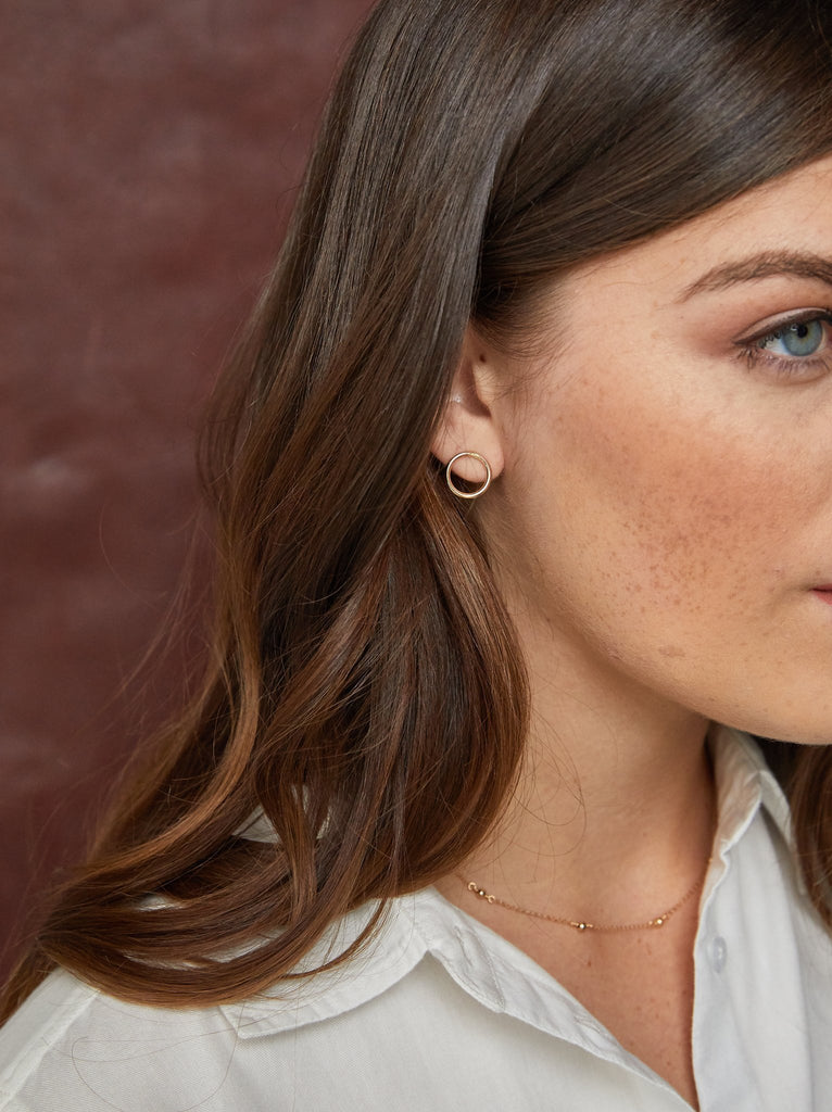 Model wearing Able brand Celine studs in 14 carat gold fill 