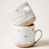 Farmhouse Pottery brand confetti heart mug stack of two on a white surface