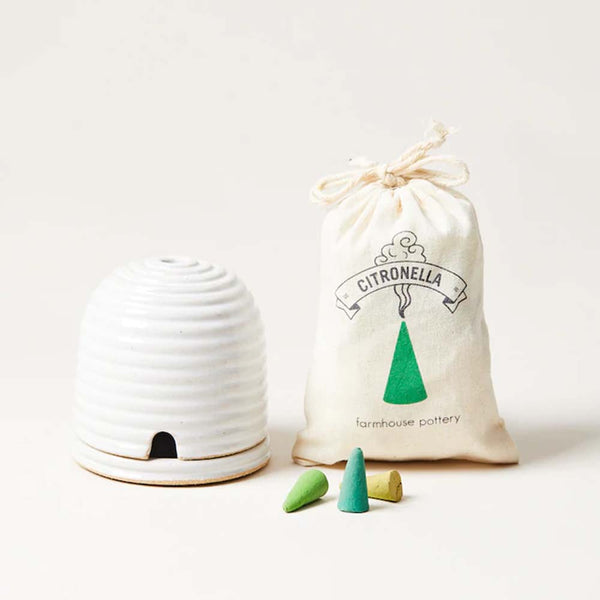 Farmhouse Pottery Beehive Burner with citronella bag and cones on a white background