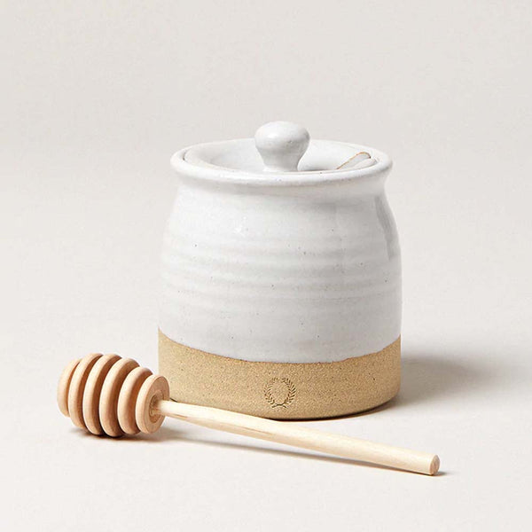 Farmhouse Pottery Beehive Honey Pot with honey dipper on a white background