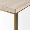 Close up of light brown wood on c-shaped side tableC style side table with light wood top and brass metal C shaped frame