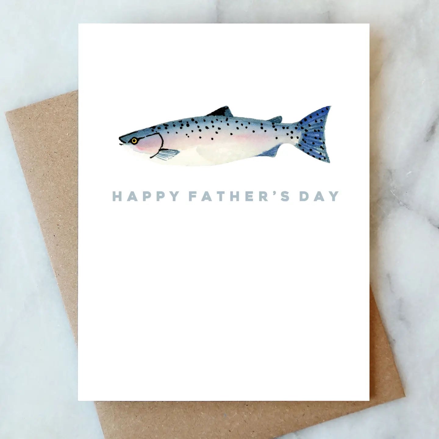 Fish Father's Day Greeting Card on a marble table at Addison West