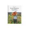 Cover art of book titled 'cut flower garden' with woman in garden holding large bouquet of pink and orange flowers