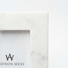 Close up of white marble picture frame on a white background