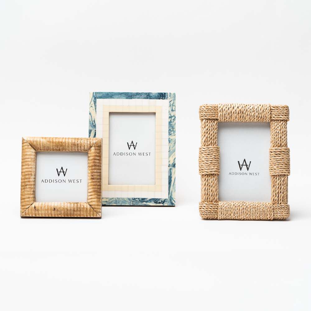 Collection of three picture frames in blue and seagrass on a white background