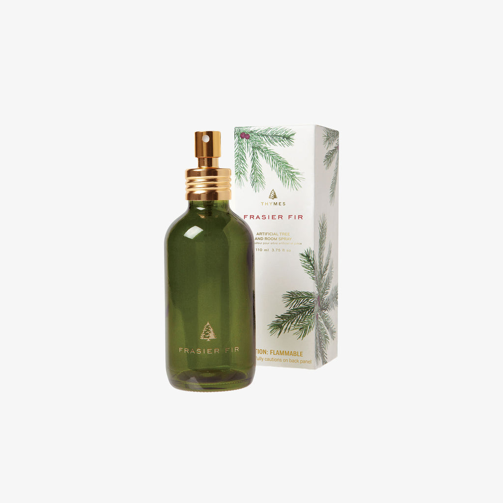 Thymes frasier fir room spray green bottle and box on a white background