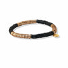 Ink and Alloy brand black and gold stretch bracelet on a white background