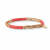Ink and Alloy brand 'Grace' stretch bracelet in coral and gold on a white background