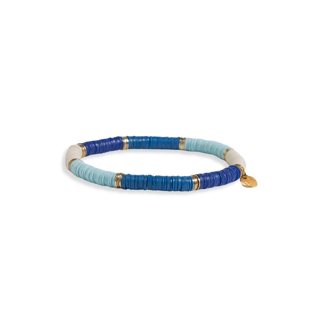 Ink and Alloy brand 'Grace' stretch bracelet in blue color blocks with gold accents on a white background