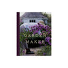 Front cover of book titled 'garden maker' with woman in straw hat picking purple blooms on a white background