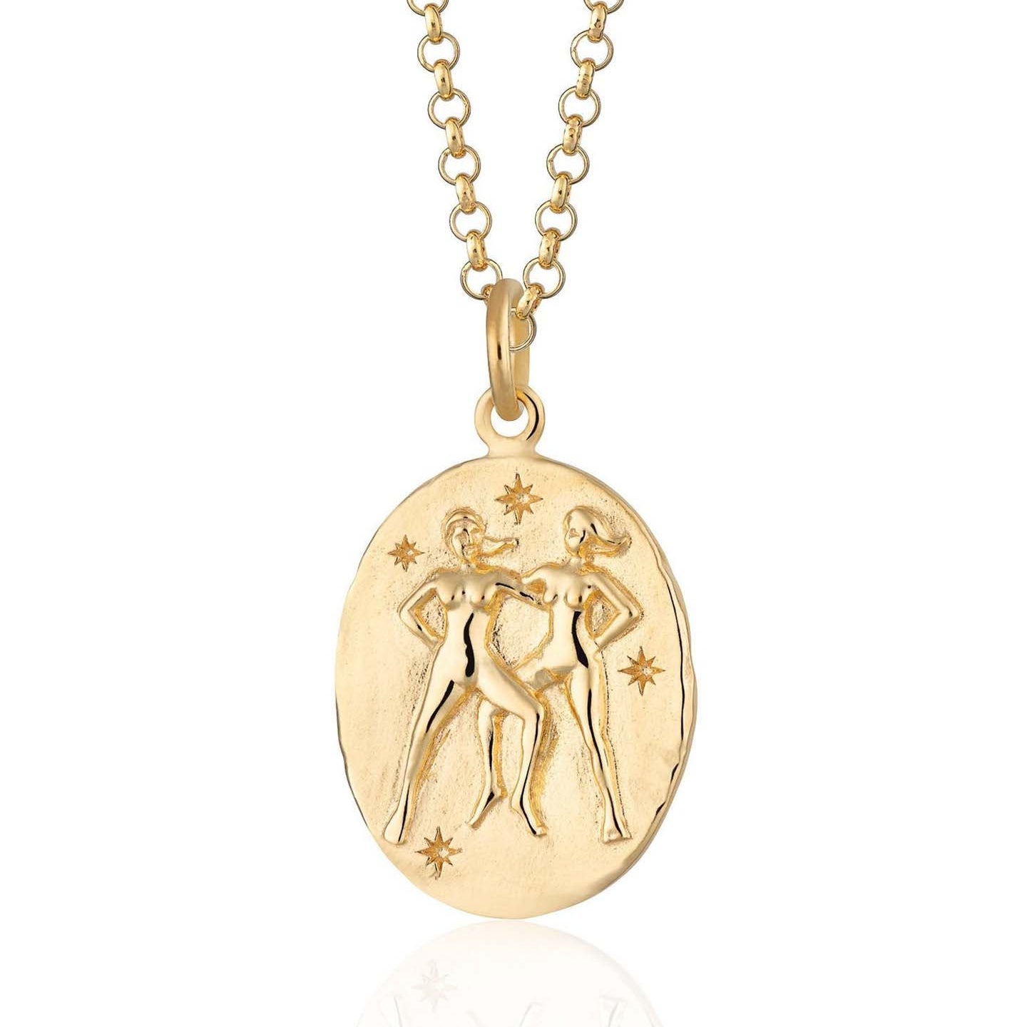 Scream Pretty brand gold Gemini zodiac star sign necklace on a white background
