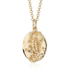 Scream Pretty brand gold Scorpio zodiac star sign necklace on a white background