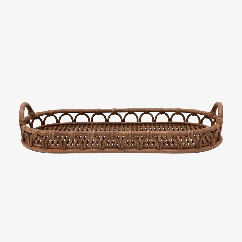 Thirty two inch long hand-woven rattan tray with handles and arched detailing on a white background