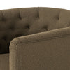 Barrel style 'Hanover' swivel chair upholstered in olive performance fabric by Four Hands furniture on a white background 