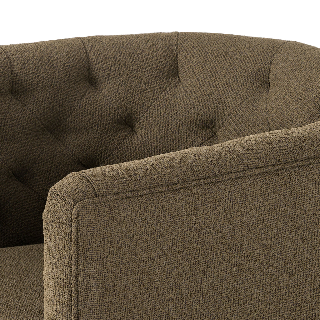 Barrel style 'Hanover' swivel chair upholstered in olive performance fabric by Four Hands furniture on a white background 