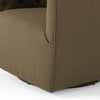 Barrel style 'Hanover' swivel chair upholstered in olive performance fabric by Four Hands furniture on a white background 