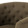 Barrel style 'Hanover' swivel chair upholstered in olive performance fabric by Four Hands furniture on a white background 