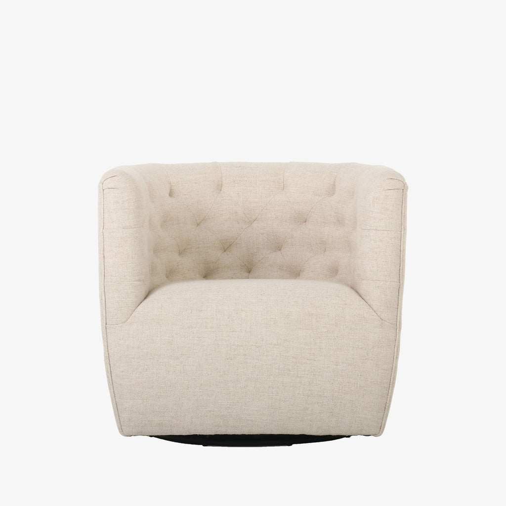 Barrel style 'Hanover' swivel chair upholstered in cream fabric by Four Hands furniture on a white background 