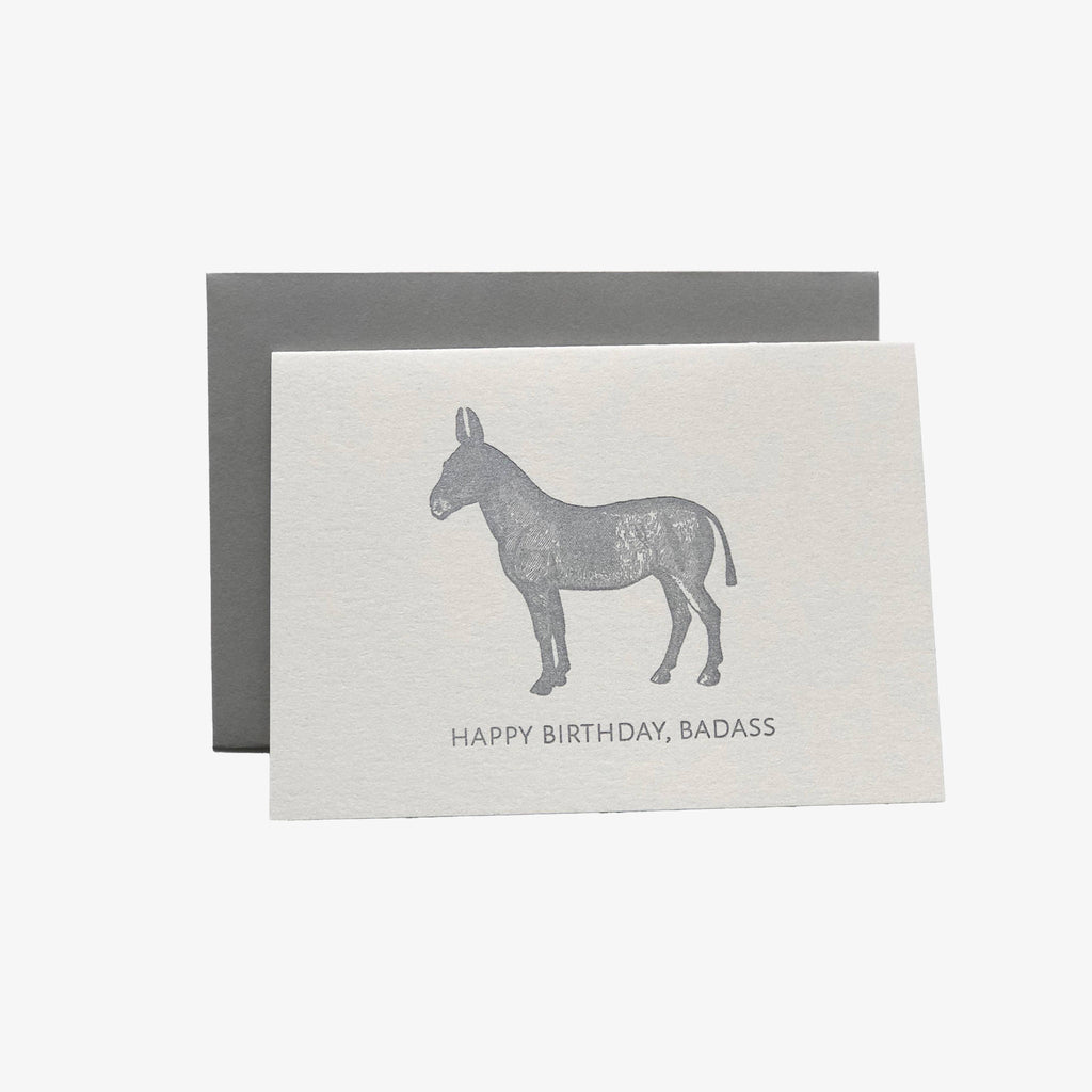 White letter press greeting card with grey donkey and 'Happy Birthday, Baddass' saying