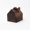 Handmade walnut stained wood barn candle holder by Hauskaa on a white background