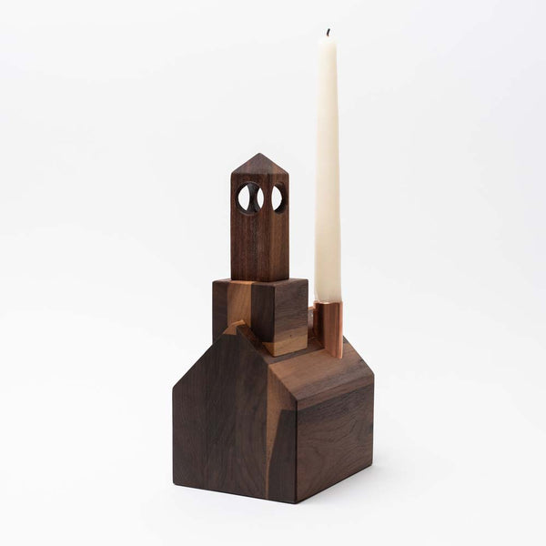 Handmade walnut stained wood church candle holder by Hauskaa on a white background