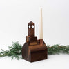 Handmade walnut stained wood church candle holder by Hauskaa on a white background