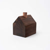 Hauskaa brand wood house candle holder in colonial style with copper chimney on a white background with greenery
