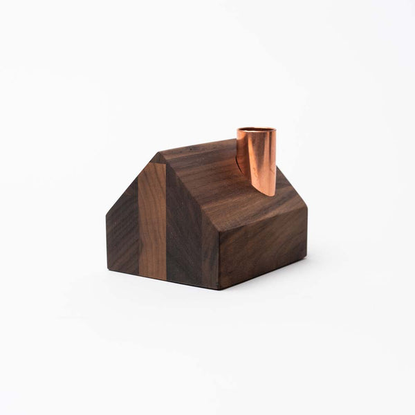 Handmade farmhouse shaped walnut stained candle holder by Hauskaa on a white background