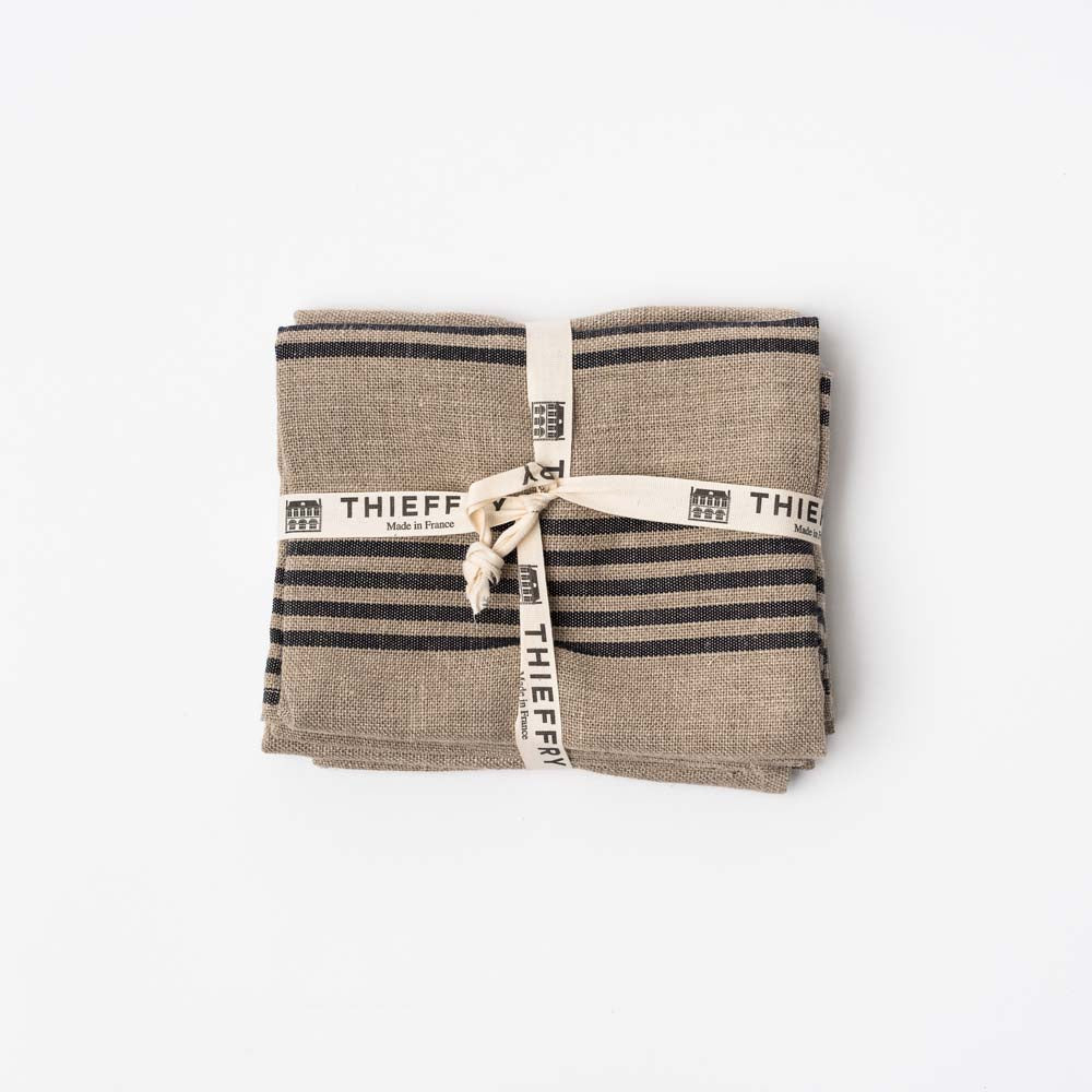 Set of two natural with black stripe Thieffry Belgian Linen kitchen tea towels on a white background tied with a bow