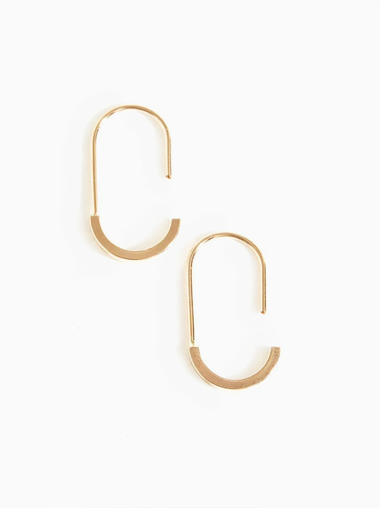 Able jewelry brand gold hinged earrings on a white background