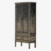 Tall 'Hitchens' cabinet with worn black paint and two doors on a white background by Four hands furniture