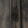 Tall 'Hitchens' cabinet with worn black paint and two doors on a white background by Four hands furniture