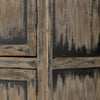 Close up of finish on Tall 'Hitchens' cabinet with worn black paint and two doors on a white background by Four hands furniture