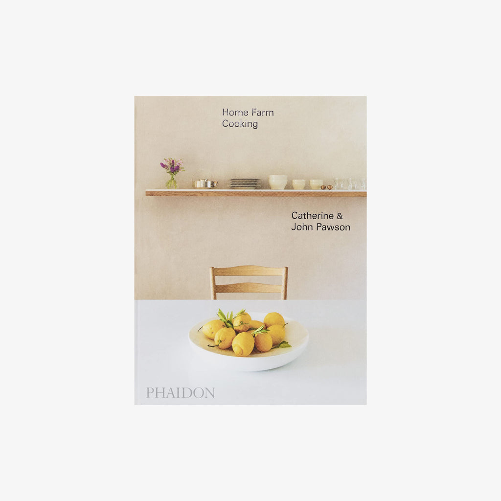 Front cover of book titled 'Home Farm Cooking' with kitchen table and bowl of lemons on a white background