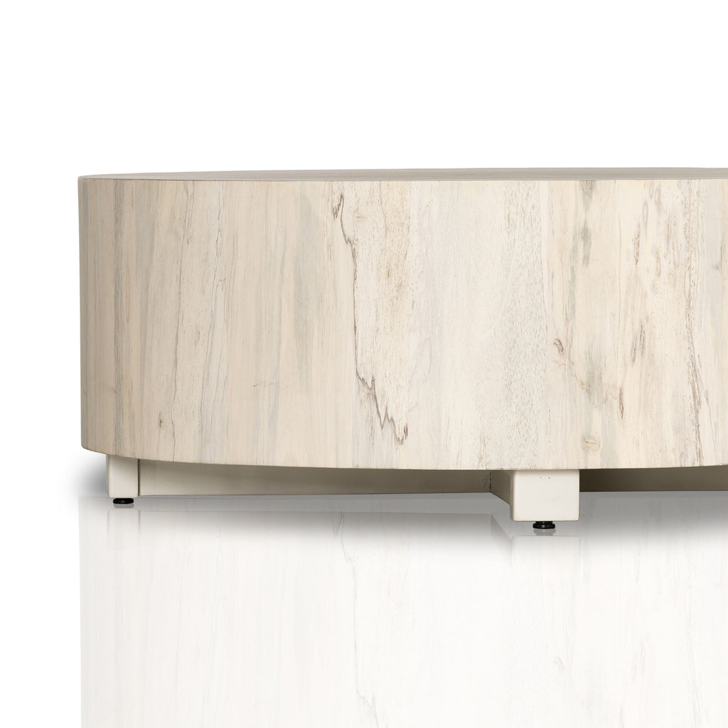 'Hudson' round coffee table by four hands furniture in light bleached spalted wood color on a white background