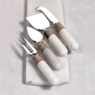Marble and wood cheese board serving set of four on a marble tray 