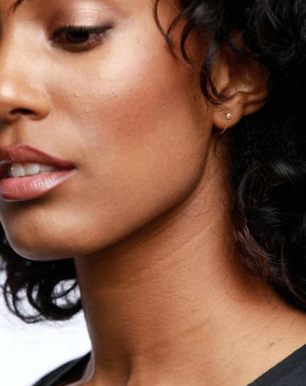Model wearing Able brand Illusion Hoops earrings 