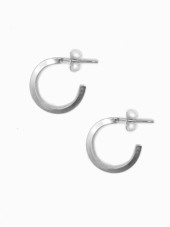 Able Brand Iris hoops in sterling silver on a white background