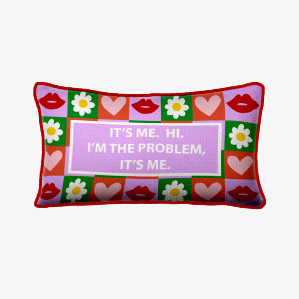Furbish brand needlepoint pillow with taylor swift saying 'it's me. hi. i'm the problem, it's me.' on a white background