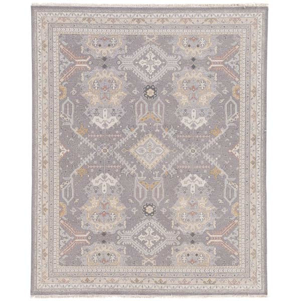Jaipur wool JAIMAK rug with Pops of gold and dusty pink on gray backdrop with classic fringe 